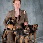 Tegan Whalan with blue border terrier bitches Myrtle, Clover, and Winnie.